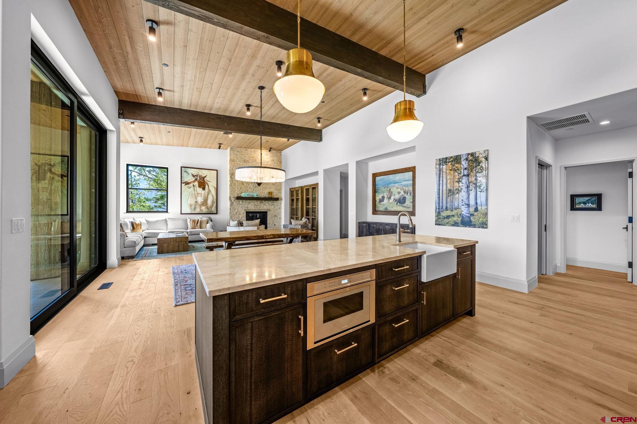 49 Bluff Drive Durango, CO 81301 - Photo 21 of 45 a large kitchen with stainless steel appliances granite countertop a lot of counter space and a chandelier