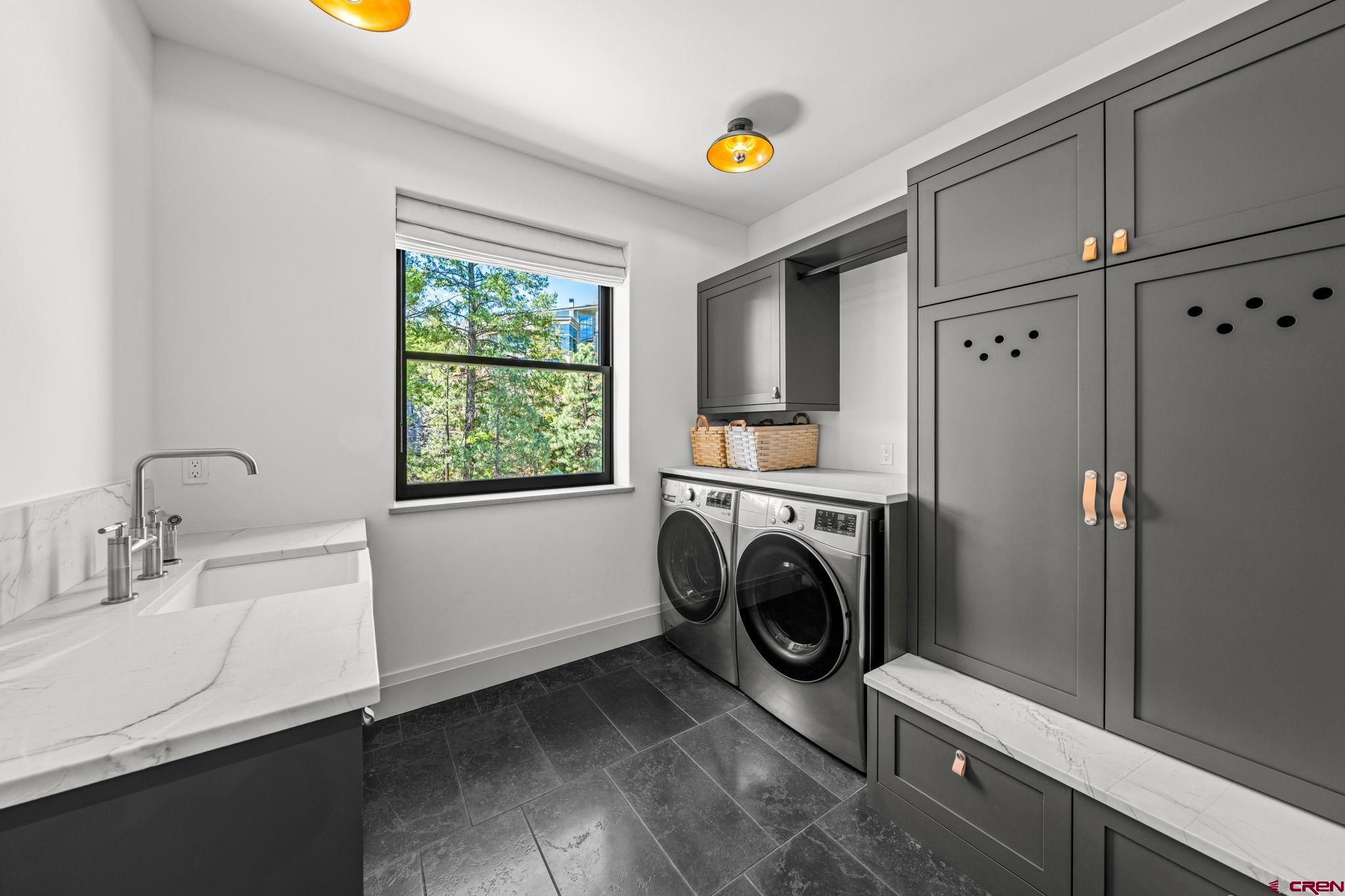 49 Bluff Drive Durango, CO 81301 - Photo 27 of 45 a utility room with dryer and washer