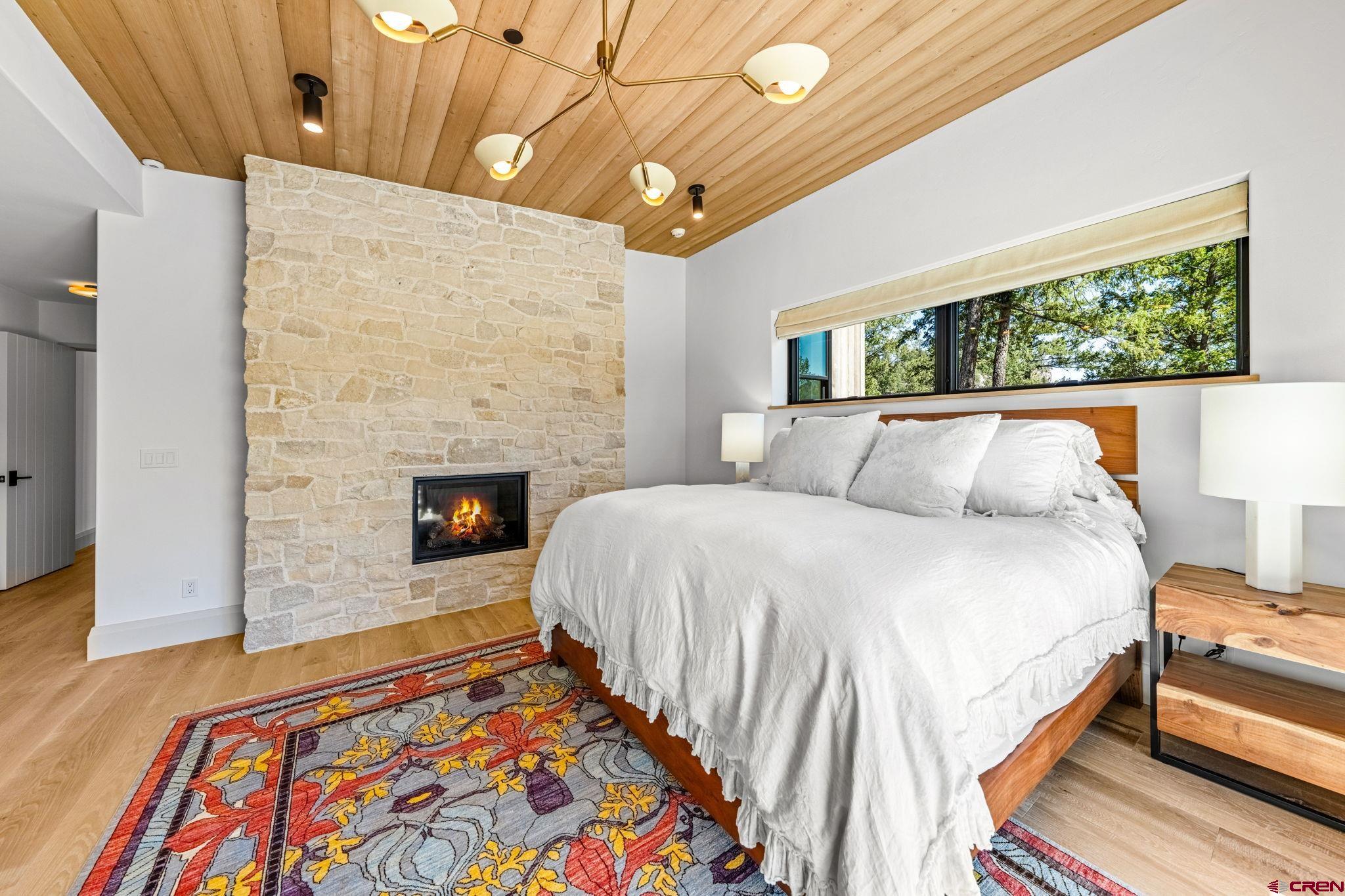 49 Bluff Drive Durango, CO 81301 - Photo 29 of 45 a bed sitting in a bedroom next to a larger window