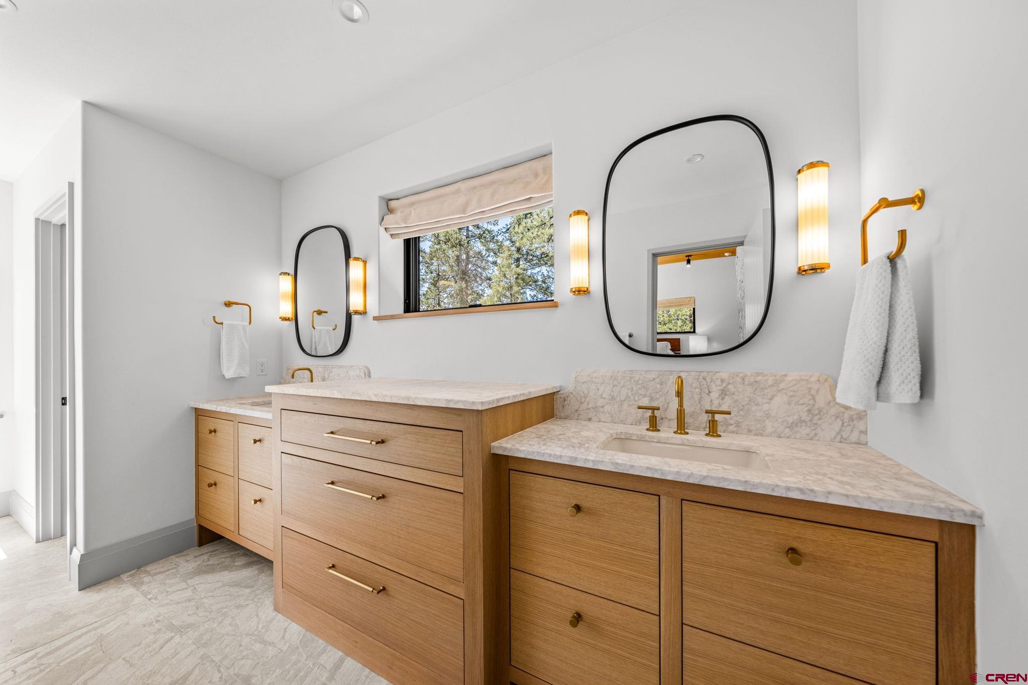 49 Bluff Drive Durango, CO 81301 - Photo 30 of 45 a bathroom with a granite countertop double vanity sink and a mirror