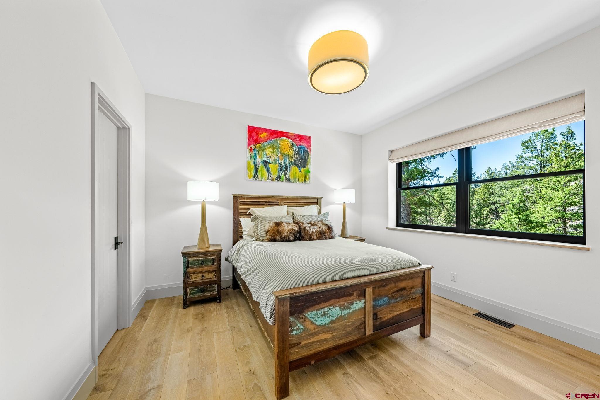 49 Bluff Drive Durango, CO 81301 - Photo 38 of 45 a bedroom with a bed and a window