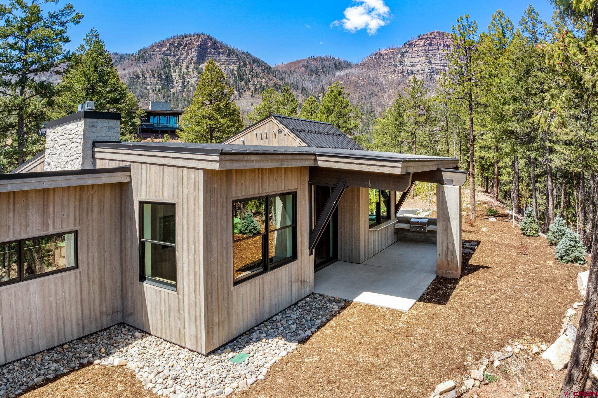 49 Bluff Drive Durango, CO 81301 - Photo 5 of 45 a view of a house with roof and sitting area