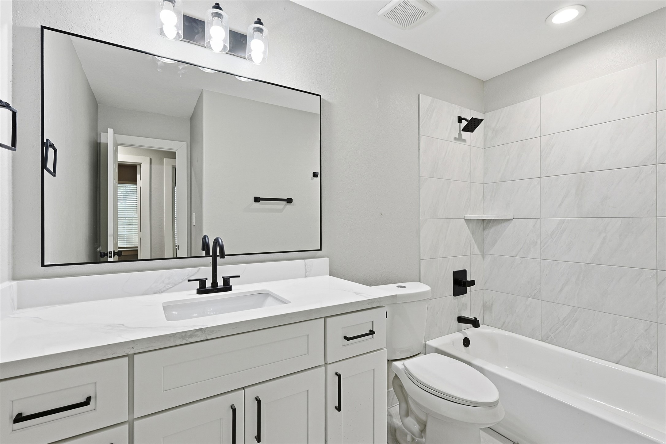 9718 Fillmore Street Houston, TX 77029 - Photo 16 of 30 a bathroom with a sink toilet tub and shower