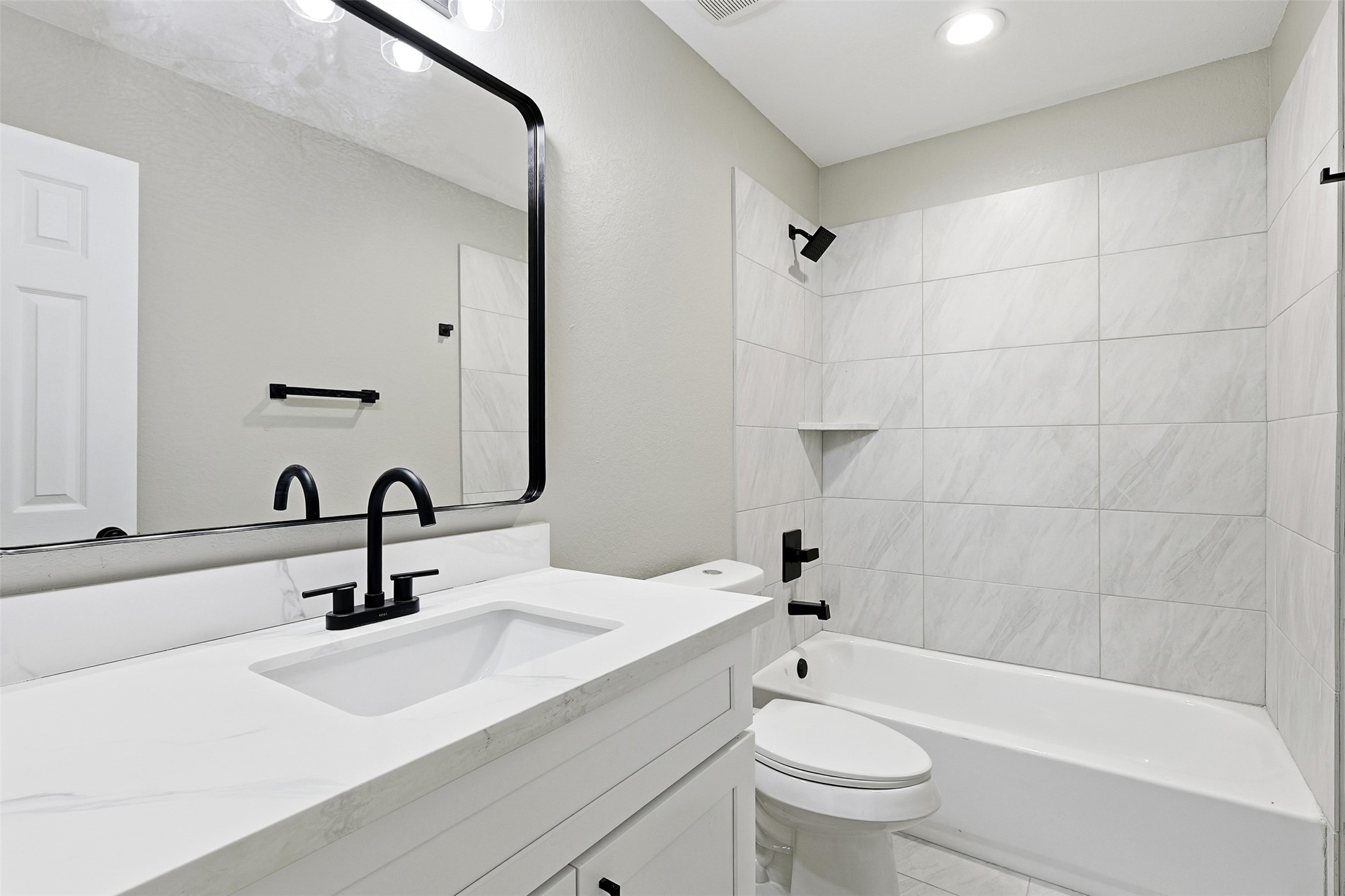 9718 Fillmore Street Houston, TX 77029 - Photo 17 of 30 a bathroom with a sink a toilet and shower