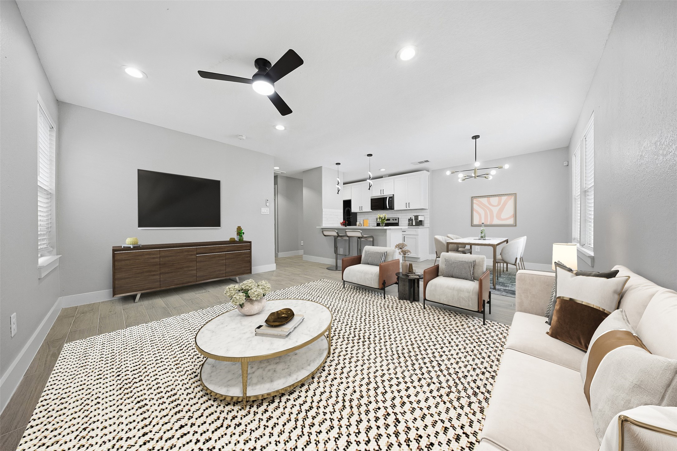 9718 Fillmore Street Houston, TX 77029 - Photo 6 of 30 a living room with furniture and a flat screen tv