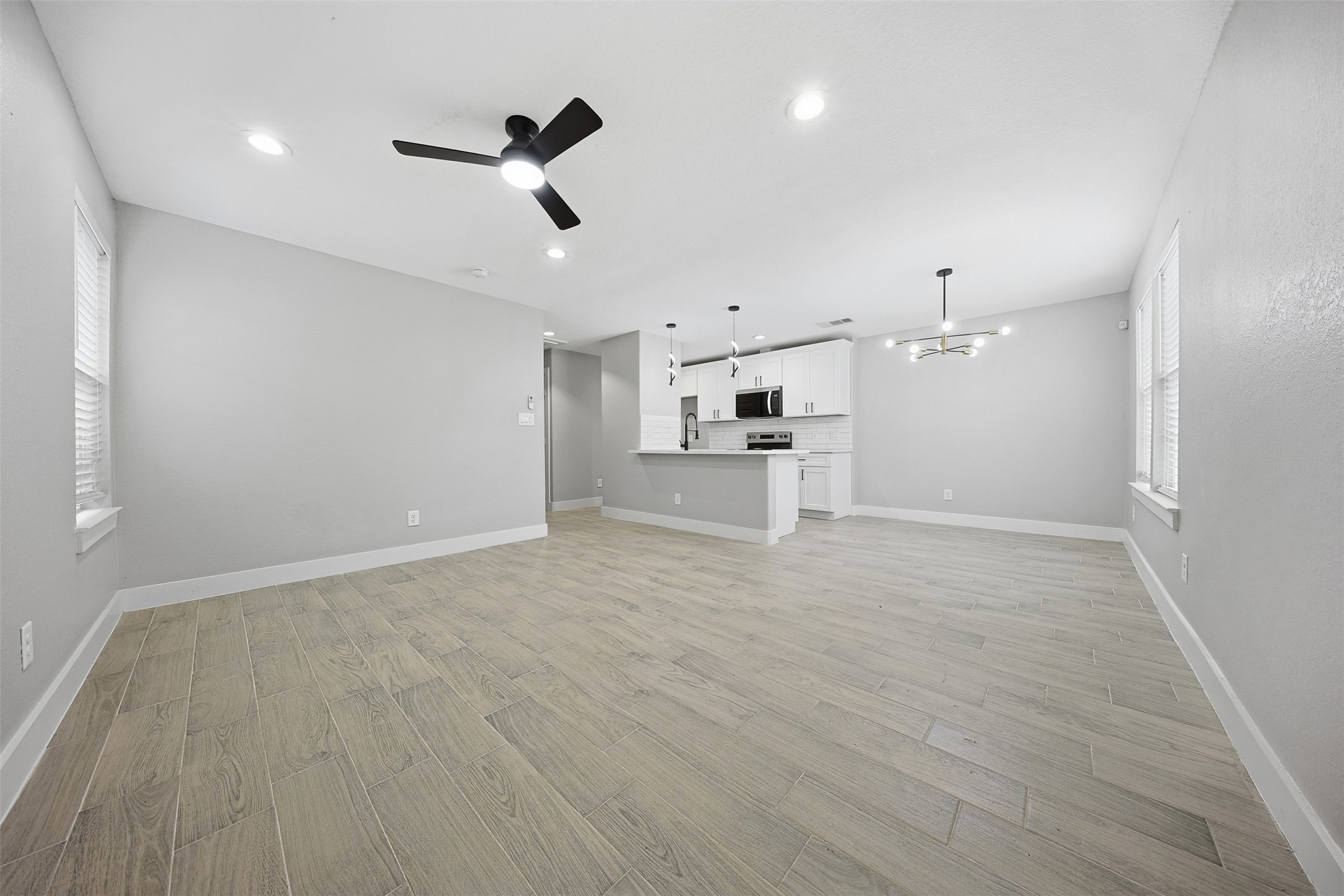 9718 Fillmore Street Houston, TX 77029 - Photo 7 of 30 a view of a kitchen with a sink and a refrigerator