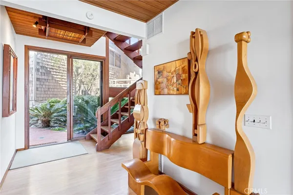 a view of an entryway with wooden floor