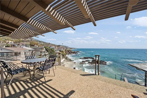 a view of a patio with a table and chairs