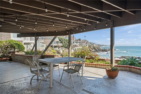 a table and chairs in front of a building