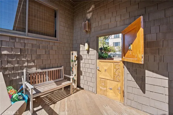 a view of balcony with wooden floor