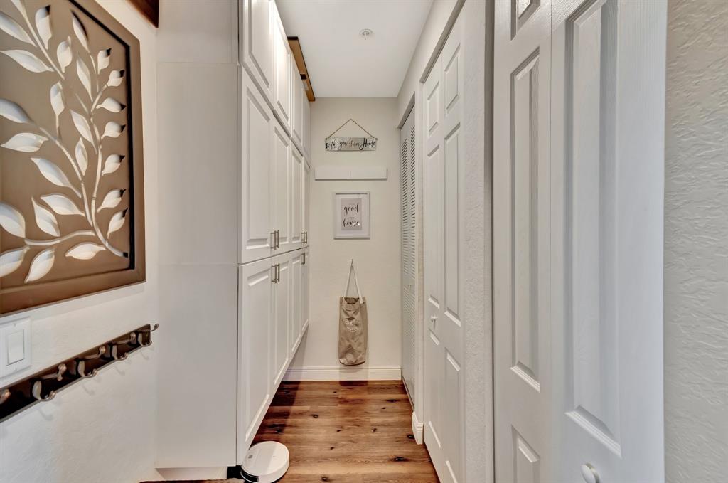 2851 Prospect Road, Unit 1209 Tamarac, FL 33309 - Photo 22 of 59 a view of a hallway with wooden floor and staircase