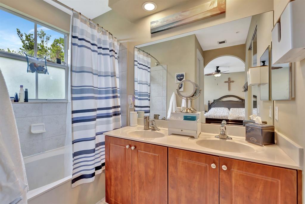 2851 Prospect Road, Unit 1209 Tamarac, FL 33309 - Photo 27 of 59 a bathroom with a sink and a mirror