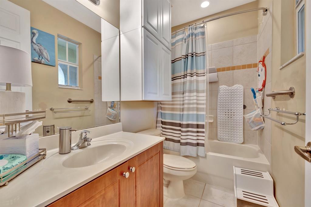 2851 Prospect Road, Unit 1209 Tamarac, FL 33309 - Photo 32 of 59 a bathroom with a sink toilet and shower