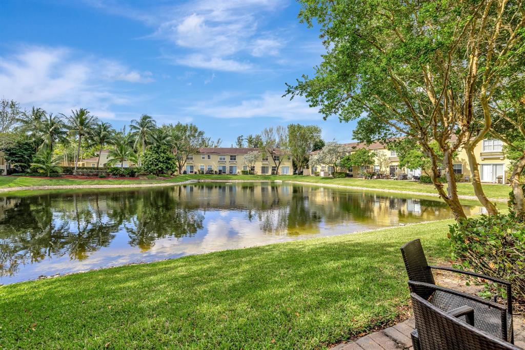 2851 Prospect Road, Unit 1209 Tamarac, FL 33309 - Photo 33 of 59 a view of a lake with a house in the background