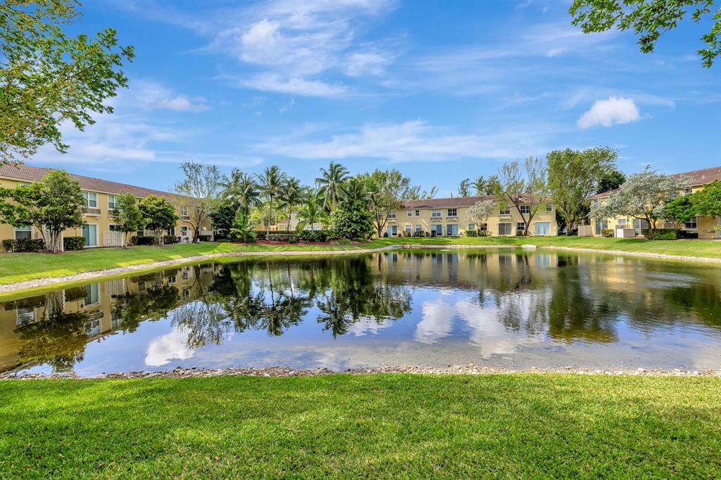 2851 Prospect Road, Unit 1209 Tamarac, FL 33309 - Photo 34 of 59 a view of a lake with houses in the back