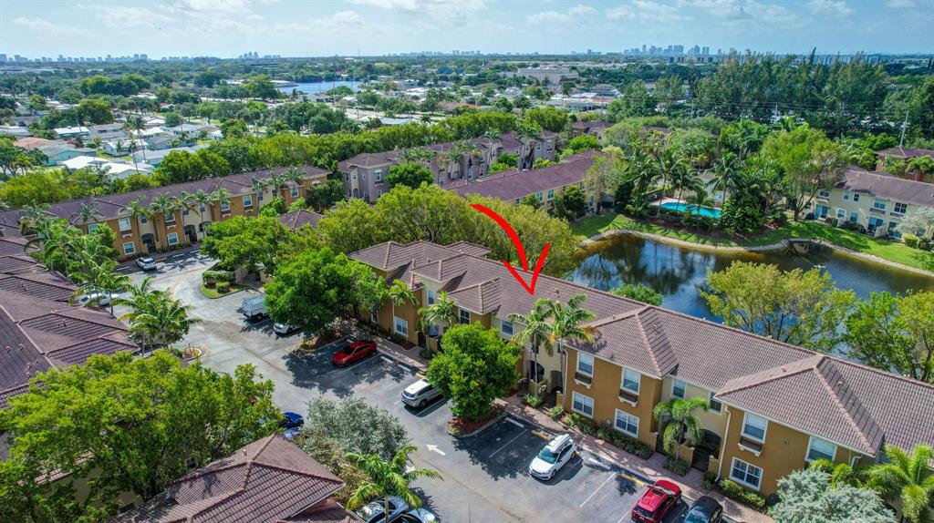 2851 Prospect Road, Unit 1209 Tamarac, FL 33309 - Photo 41 of 59 an aerial view of a house with a lake view