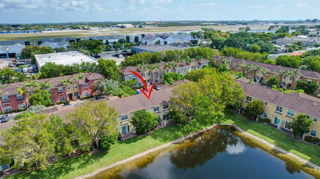 2851 Prospect Road, Unit 1209 Tamarac, FL 33309 - Photo 42 of 59 an aerial view of a house with a garden and lake view