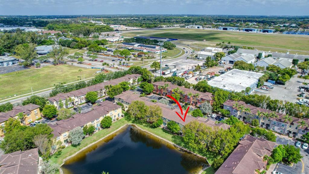 2851 Prospect Road, Unit 1209 Tamarac, FL 33309 - Photo 46 of 59 an aerial view of lake residential house with outdoor space