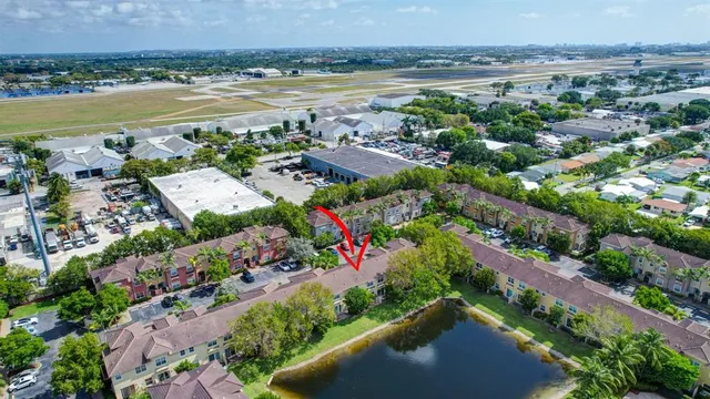 a front view of a house with a yard and a garden