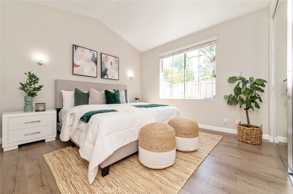 12 Parthenia Irvine, CA 92606 - Photo 12 of 25 a bedroom with a large bed and a potted plant
