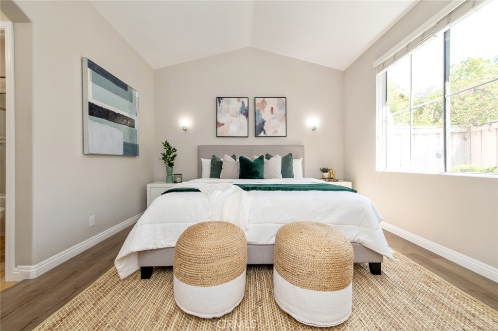 12 Parthenia Irvine, CA 92606 - Photo 13 of 25 a bedroom with a bed and a large window with outer view