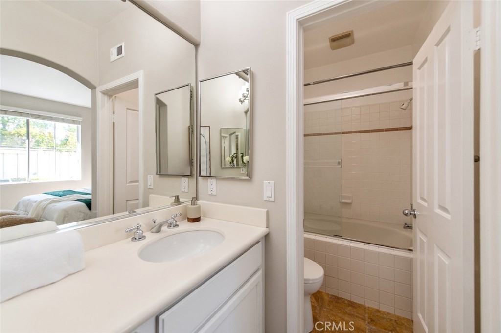 12 Parthenia Irvine, CA 92606 - Photo 15 of 25 a bathroom with a granite countertop sink toilet and shower