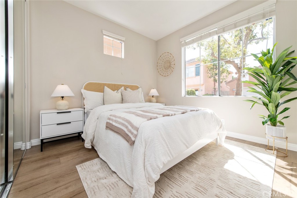 12 Parthenia Irvine, CA 92606 - Photo 16 of 25 a bed room with a bed and a potted plant