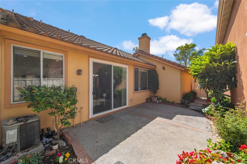 12 Parthenia Irvine, CA 92606 - Photo 19 of 25 a view of a house with potted plants