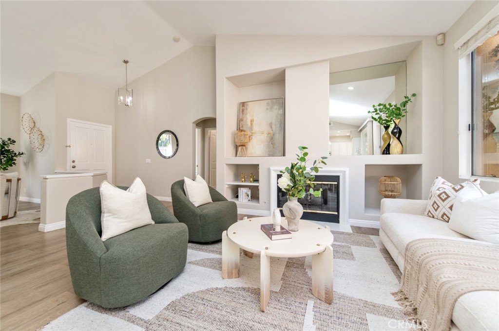 12 Parthenia Irvine, CA 92606 - Photo 6 of 25 a living room with furniture kitchen view and a potted plant