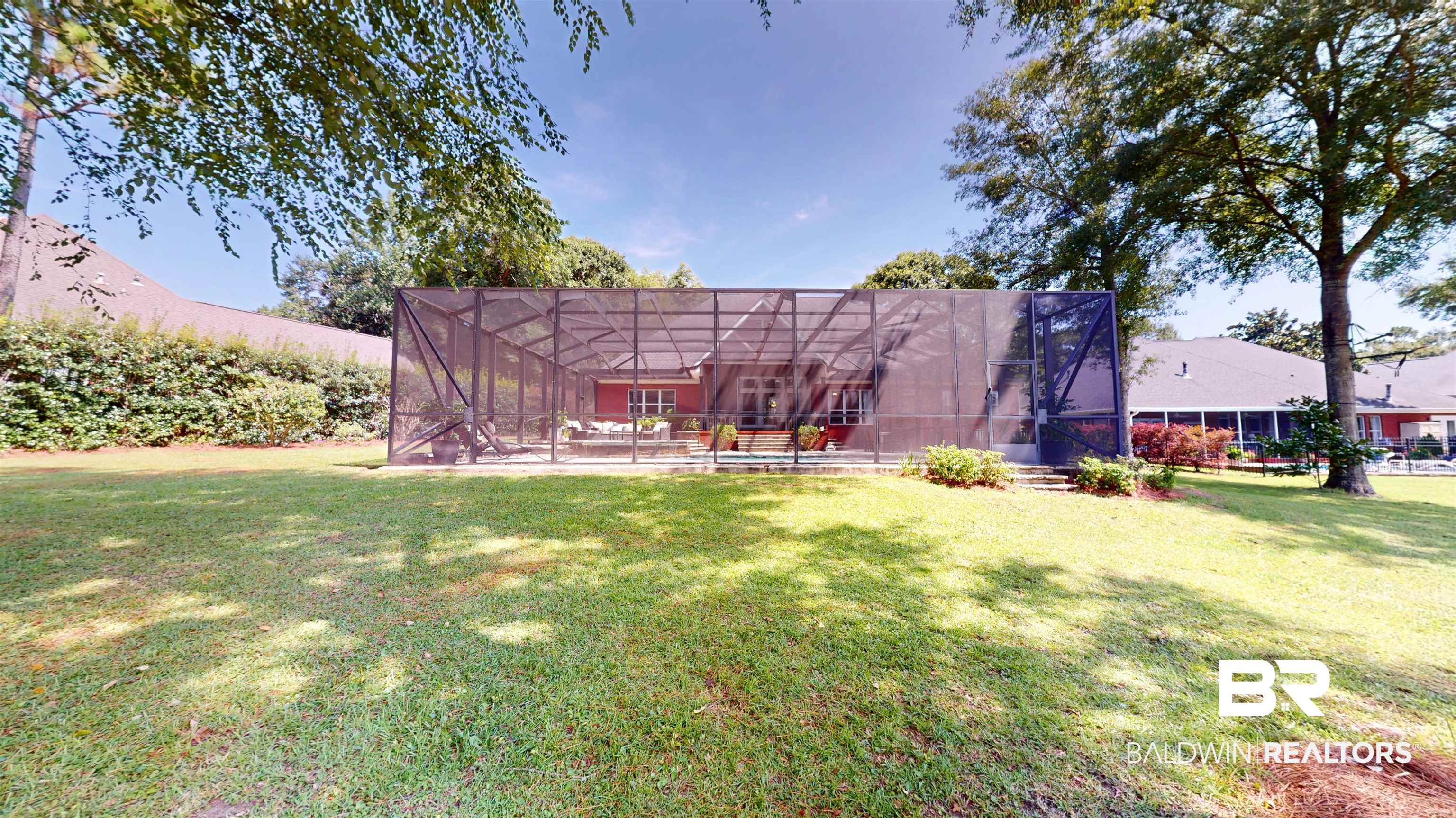 8775 Dawes Lake Road North Mobile, AL 36619 - Photo 53 of 59 Rear view of house with a lawn and glass enclosure