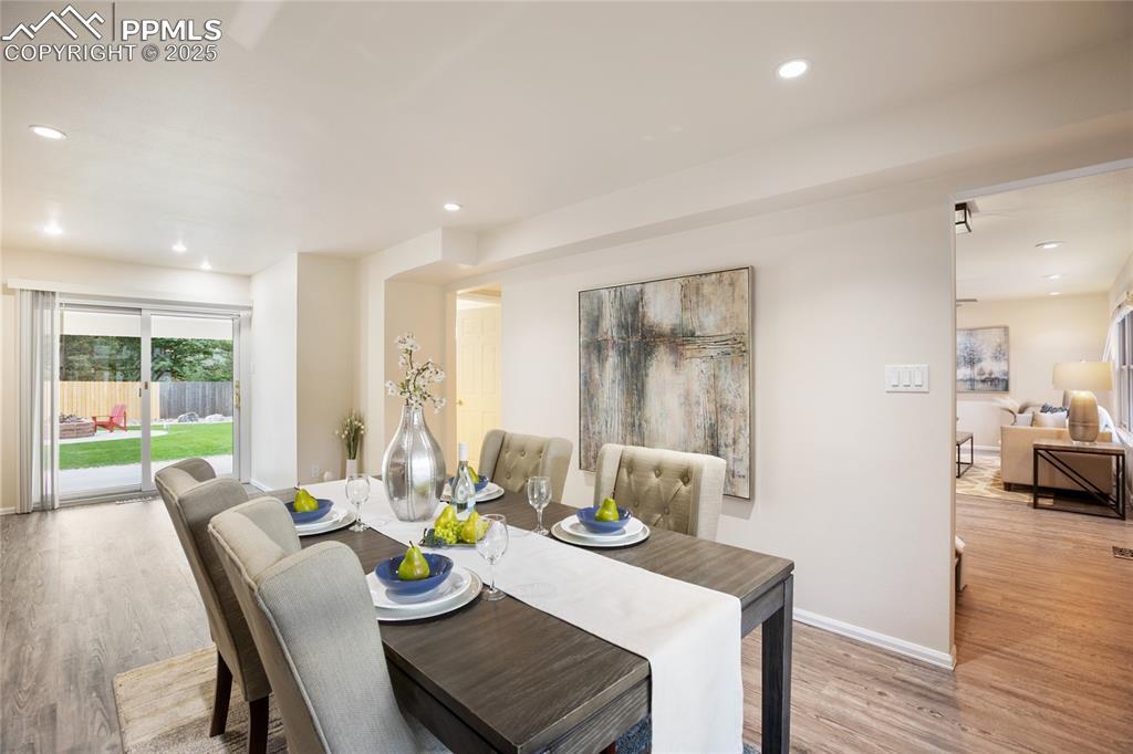 3004 Springlake Circle East Colorado Springs, CO 80906 - Photo 21 of 50 a view of a dining room with furniture window and wooden floor