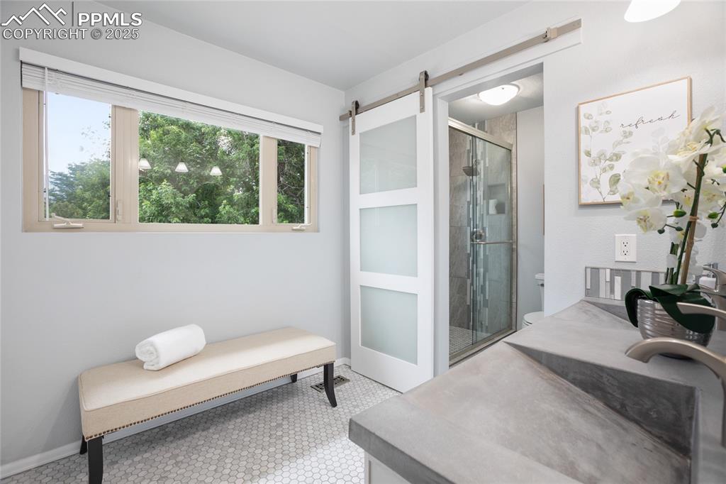 3004 Springlake Circle East Colorado Springs, CO 80906 - Photo 26 of 50 a bedroom with a bed and a couch