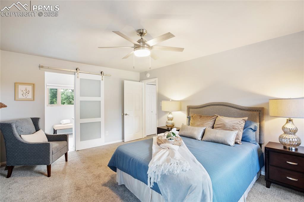 3004 Springlake Circle East Colorado Springs, CO 80906 - Photo 27 of 50 a bedroom with a bed and a chair