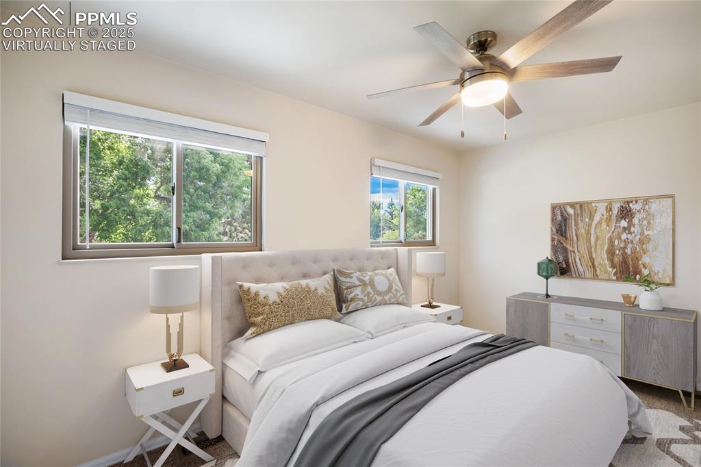 3004 Springlake Circle East Colorado Springs, CO 80906 - Photo 32 of 50 a bedroom with a large bed and a window