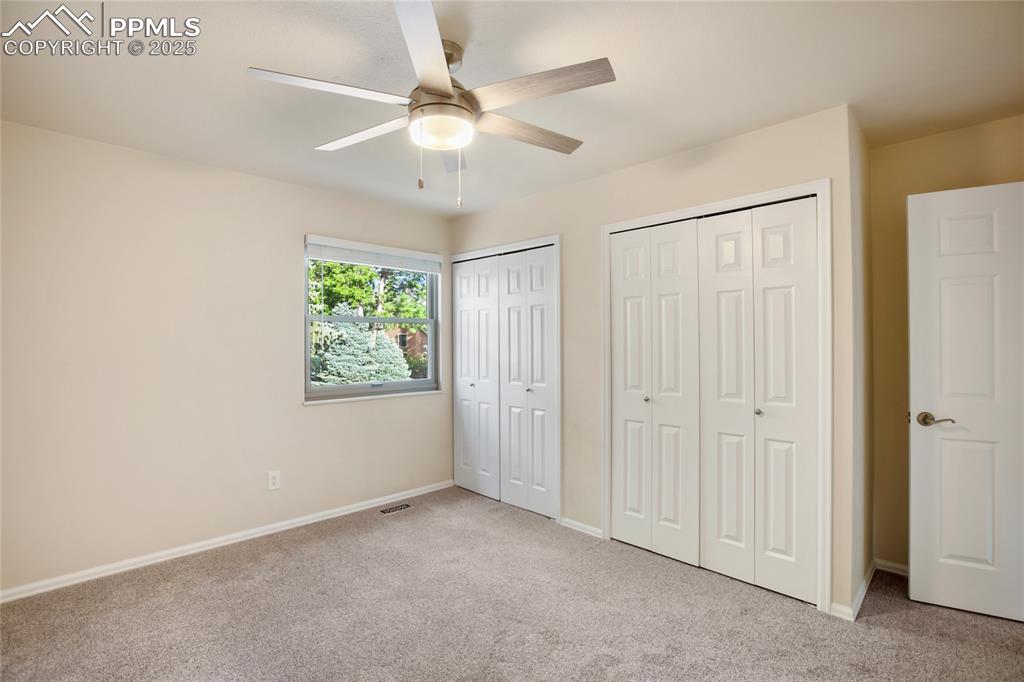 3004 Springlake Circle East Colorado Springs, CO 80906 - Photo 34 of 50 an empty room with fan and windows