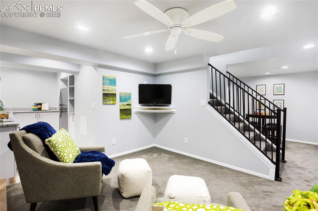 3004 Springlake Circle East Colorado Springs, CO 80906 - Photo 37 of 50 a living room with furniture and a flat screen tv