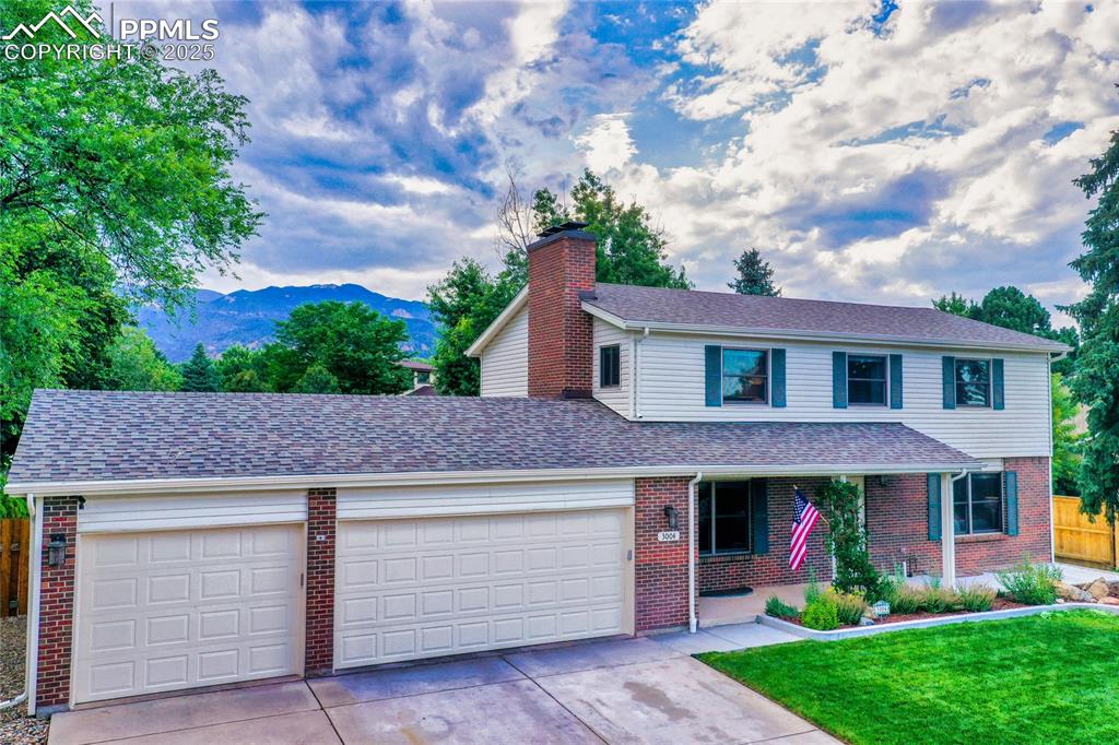 3004 Springlake Circle East Colorado Springs, CO 80906 - Photo 6 of 50 a front view of a house with a garden