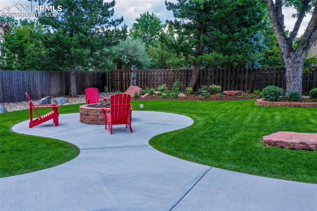 3004 Springlake Circle East Colorado Springs, CO 80906 - Photo 7 of 50 a view of backyard with sitting area and slide