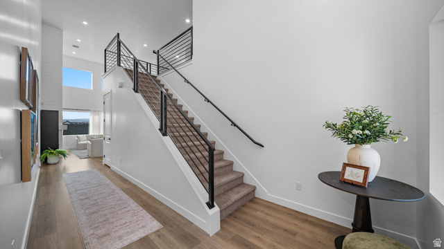 324 North Rhyolite Drive, Unit 87 Hurricane, UT 84737 - Photo 13 of 33 Stairway featuring a high ceiling, wood finished floors, and recessed lighting