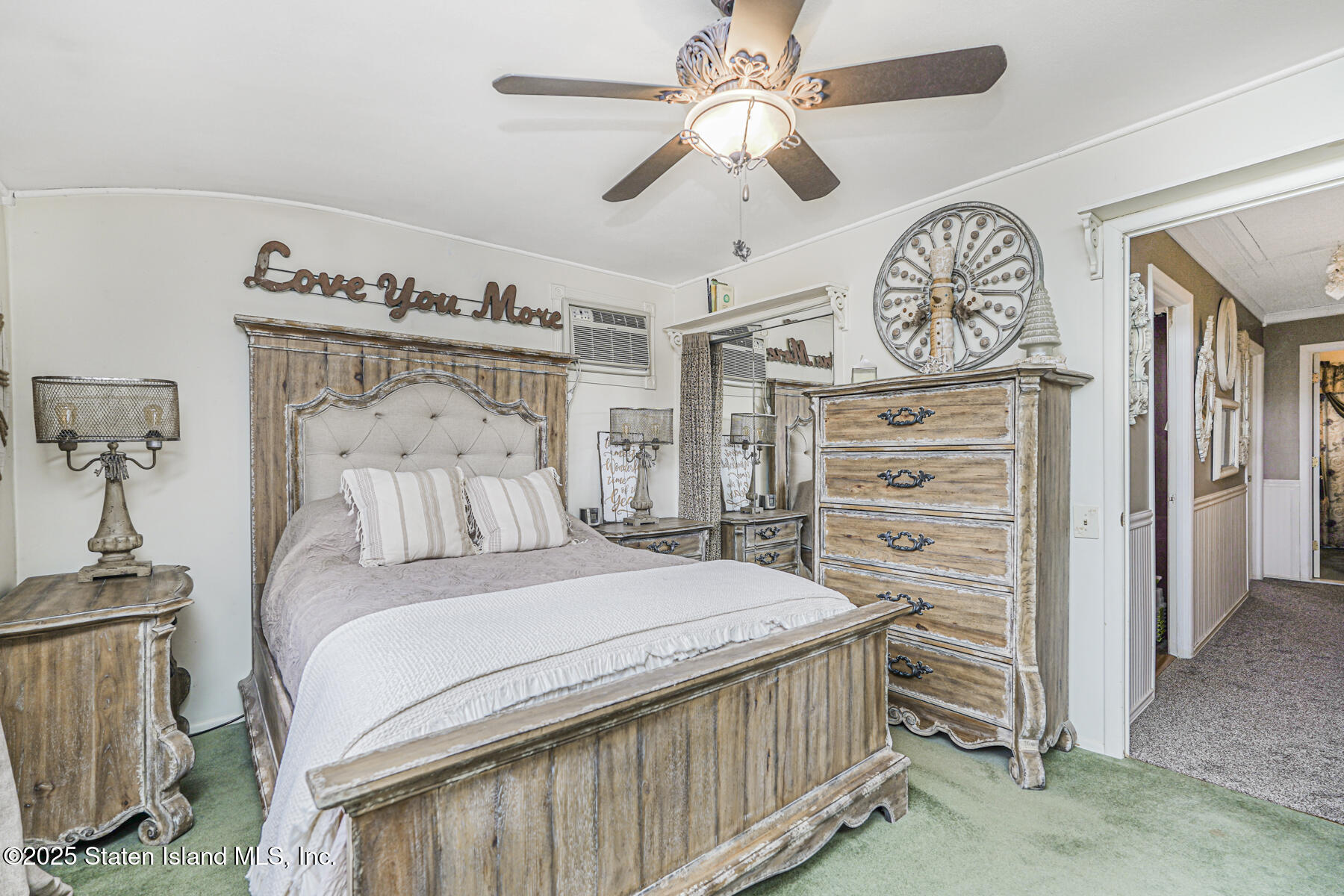 197 Crossfield Avenue Staten Island, NY 10312 - Photo 13 of 28 a bedroom with a bed and a chandelier