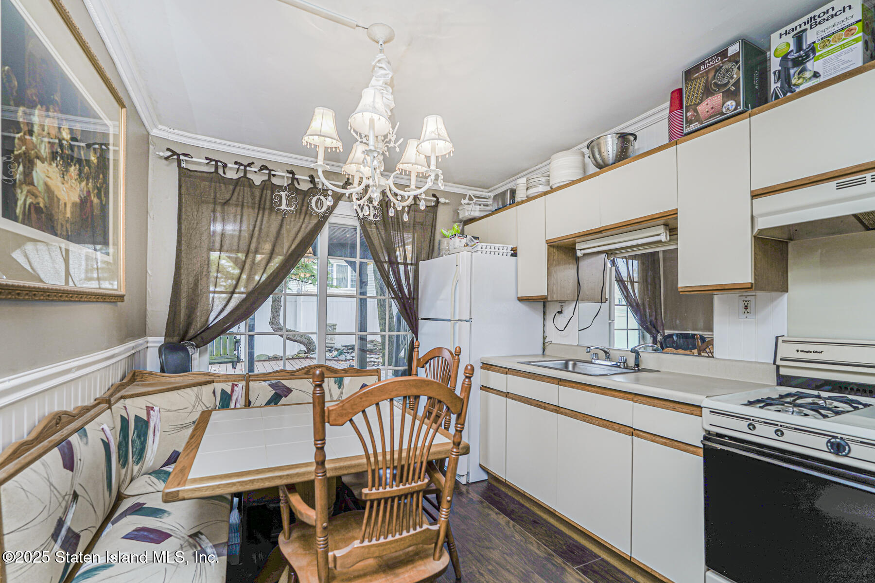 197 Crossfield Avenue Staten Island, NY 10312 - Photo 19 of 28 a dining room with furniture a rug and wooden floor