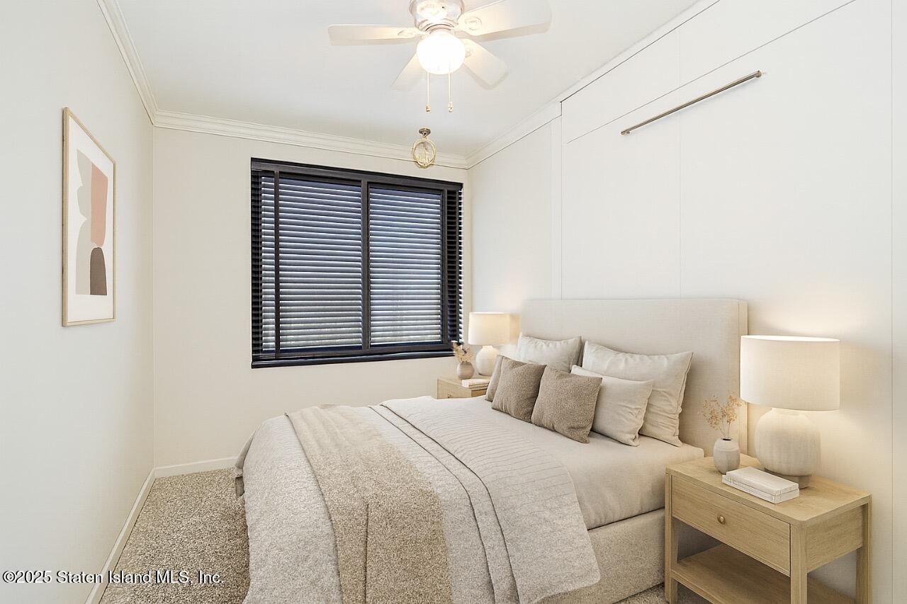 197 Crossfield Avenue Staten Island, NY 10312 - Photo 21 of 28 a bedroom with a bed and a window