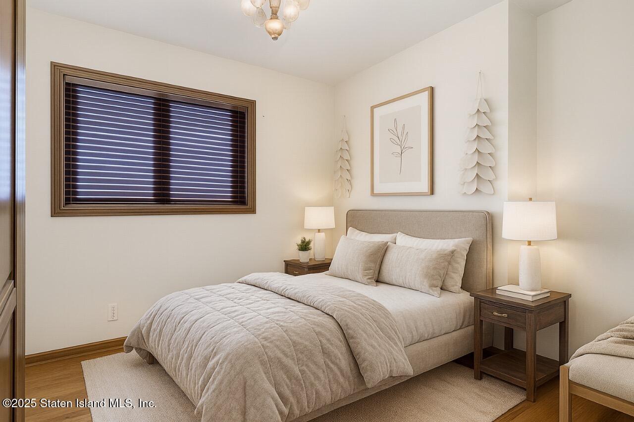 197 Crossfield Avenue Staten Island, NY 10312 - Photo 22 of 28 a bedroom with a bed and a window