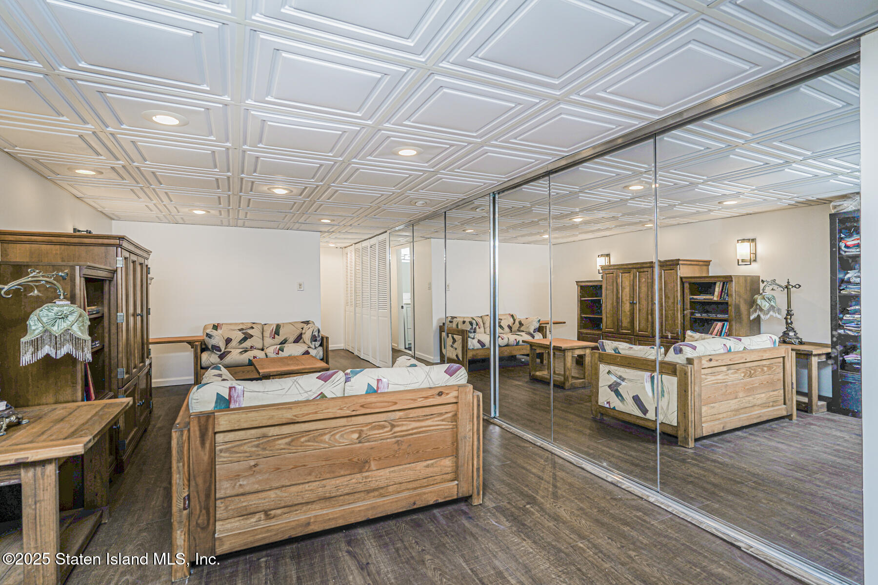 197 Crossfield Avenue Staten Island, NY 10312 - Photo 24 of 28 a living room with furniture and a chandelier