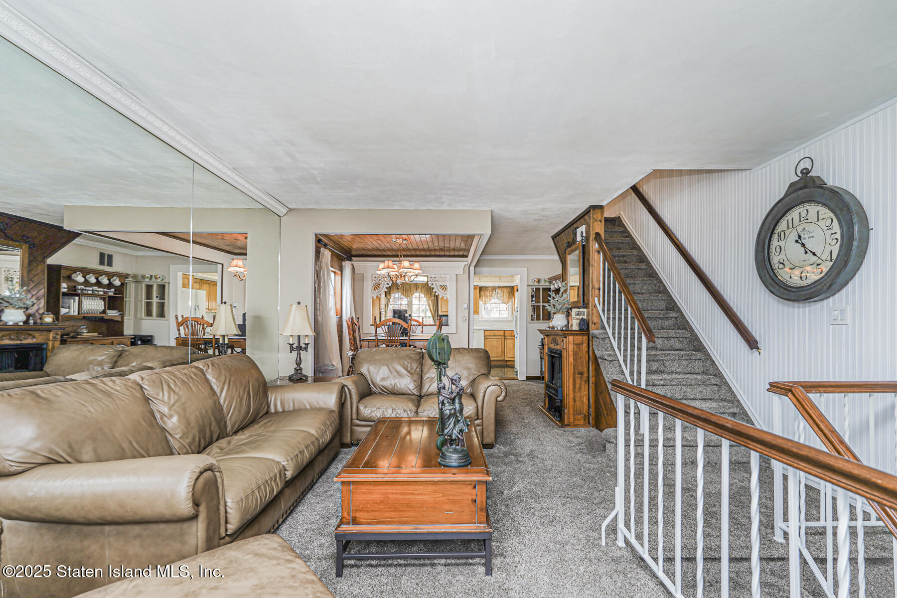 197 Crossfield Avenue Staten Island, NY 10312 - Photo 3 of 28 a living room with furniture a clock and a table
