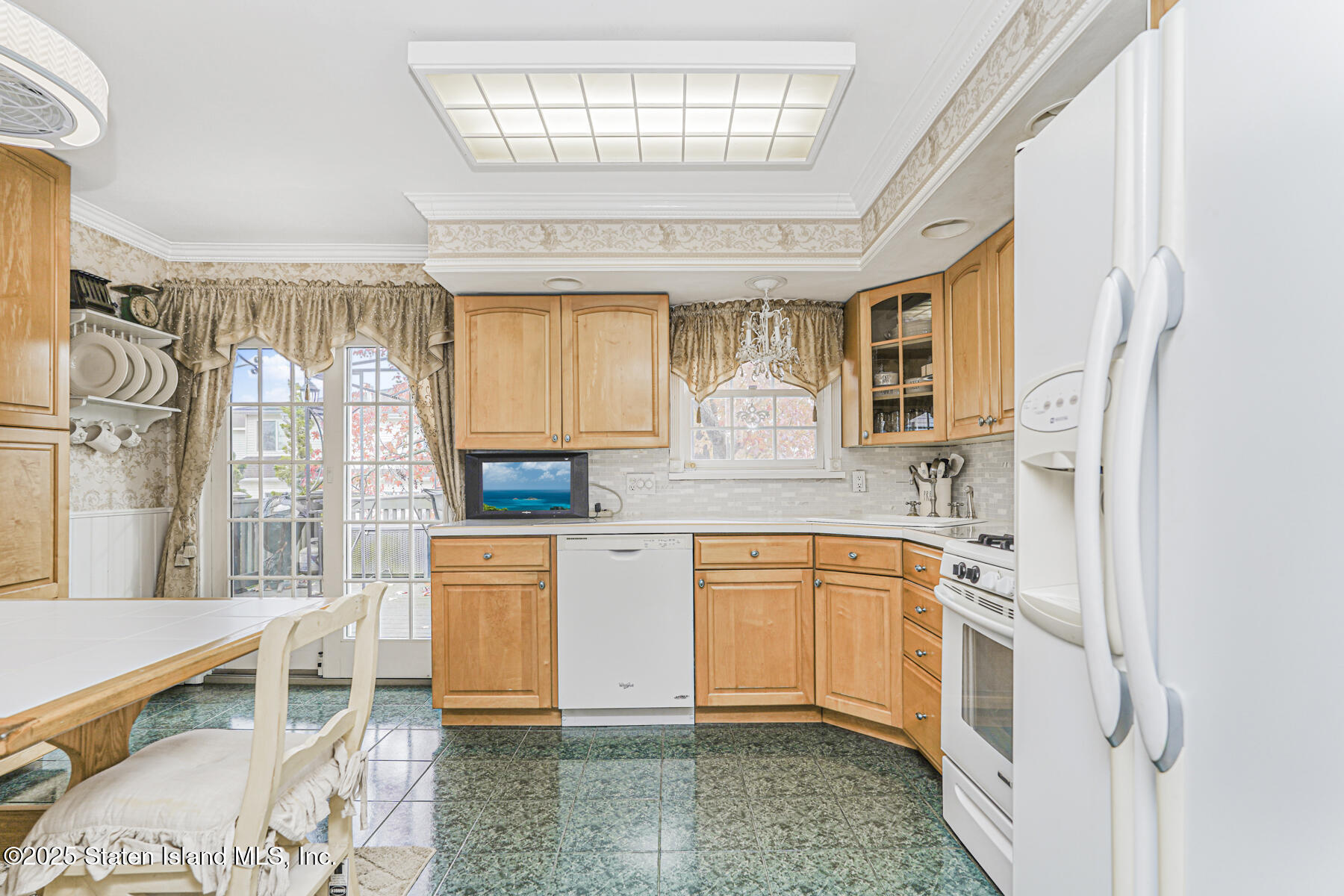 197 Crossfield Avenue Staten Island, NY 10312 - Photo 6 of 28 a kitchen with stainless steel appliances granite countertop a stove a sink and a refrigerator