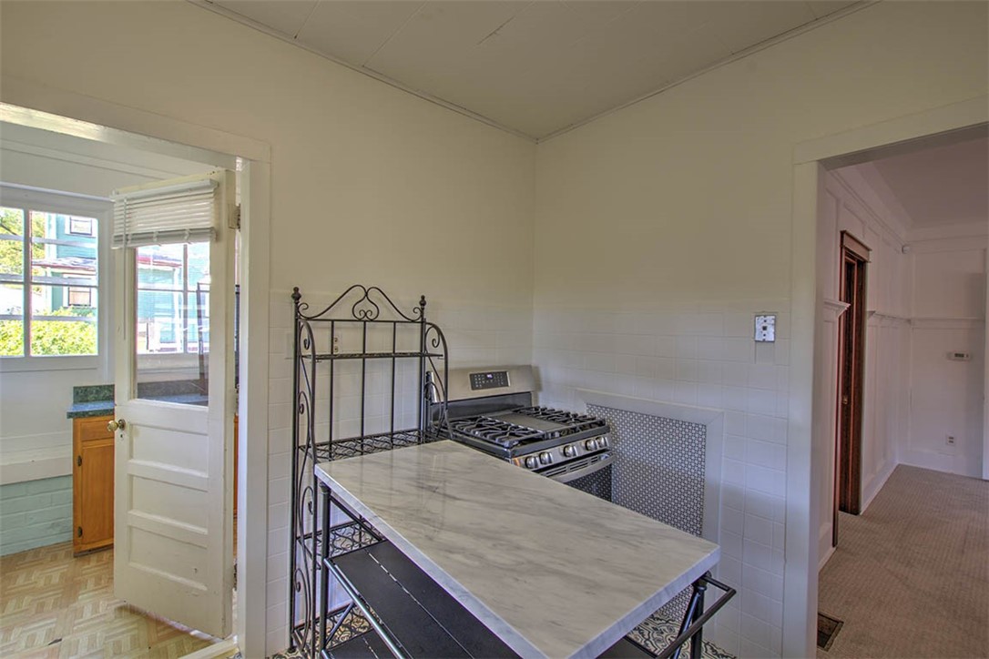531 West William Street Decatur, IL 62522 - Photo 10 of 28 a kitchen that has a sink and a stove in it