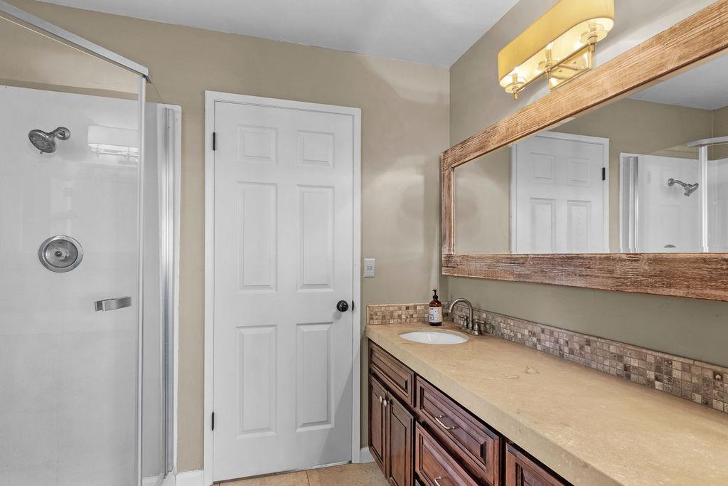 4930 South Faith Home Road Turlock, CA 95380 - Photo 27 of 69 bathroom with vanity, a stall shower, and light tile patterned floors
