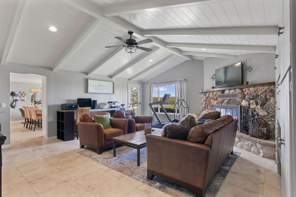 4930 South Faith Home Road Turlock, CA 95380 - Photo 28 of 69 Family room area with a stone fireplace, recessed lighting, and vaulted ceiling.