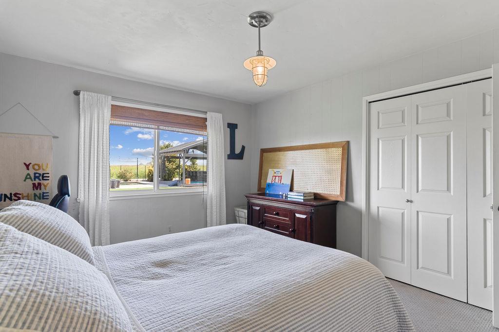 4930 South Faith Home Road Turlock, CA 95380 - Photo 33 of 69 bedroom featuring carpet flooring and a cedar closet